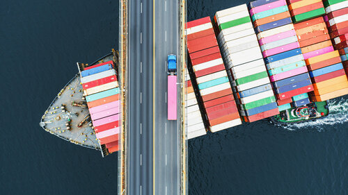 Container Ship Beneath Bridge