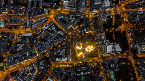 Aerial Overhead View of Frankfurt am Main, Germany Skyline at Night with glowing Streets