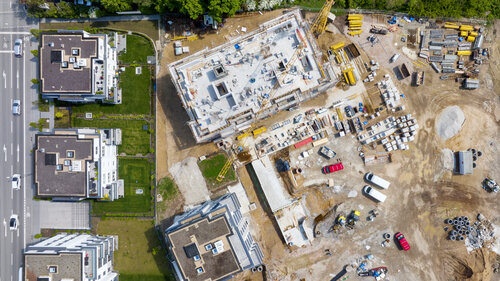 Large construction site, cranes and equipment - aerial view