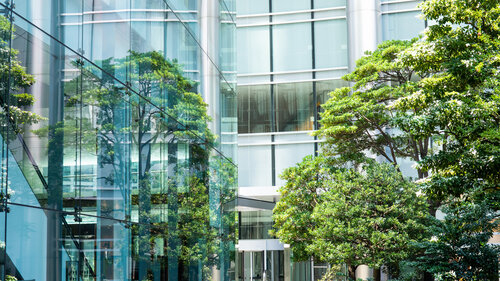 Sky and clouds reflected in a modern building glass facade Sky and clouds reflected in a modern building glass facade