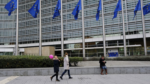 Pedestrians walk outside of the European Commission's Berlaymont building in Brussels, Belgium on Oct. 31, 2018